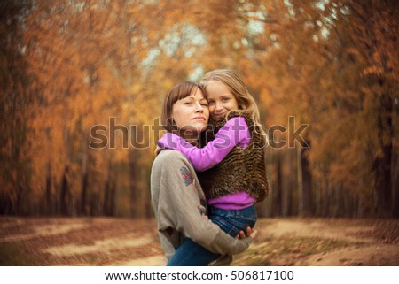 Similar – Mother with her seven year old daughter laughing in a cabin in the countryside.