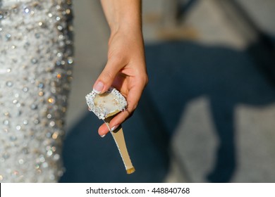 Woman Holds In Her Hand A Heel Of A Broken Shoe