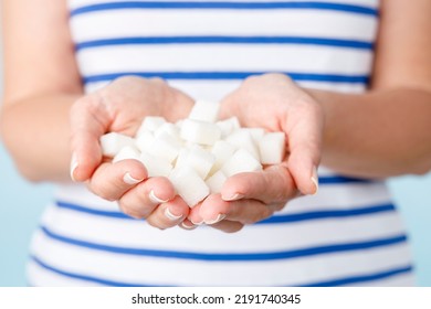 Woman Holds In Her Hands The White Sugar Cubes
