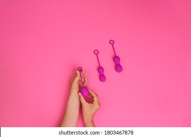 Woman Holds A Kegel Trainer. Latex Vaginal Vibrator For Training The Pelvic Floor Muscles With An Antenna. The Device For Imbuilding. Women Health. High Quality . Copy Space. Banner