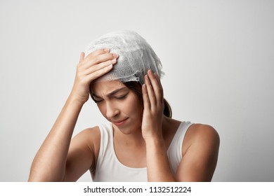    A Woman Holds On To Her Head A Migraine Concussion                            