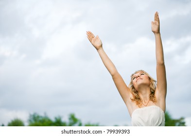 The woman holds out his hands up to heaven - Shutterstock ID 79939393