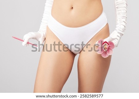 Similar – Image, Stock Photo Woman holding pink orchid