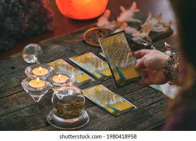 Woman Holds Tarot Cards In Her Hands. Concept Of Psychic Advisor Or Ways Of Divination