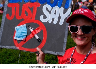 A Woman Holing A Sign Attends At The Los Angeles 