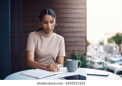 Woman, home and balcony with writing on notebook for planning, agenda and schedule as journalist. Female person, remote work and freelancer with investigation for headline story, article and report