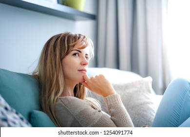 Woman At Home Deep In Thoughts Thinking And Planning