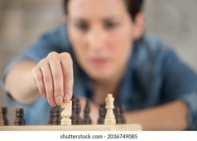 Woman At Home Playing Chess Alone