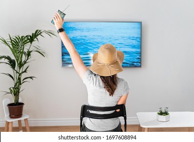 Woman At Home Pretending To Be On The Beach. TV Screen. 2020 Summer Quarantine Travel. Stay Home