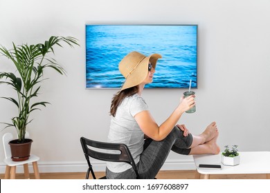 Woman At Home Pretending To Be On The Beach. TV Screen. 2020 Summer Quarantine Travel. Stay Home