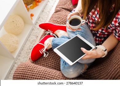 Woman At Home Relaxing On Sofa Couch Reading Email On The Tablet Computer Wifi Connection