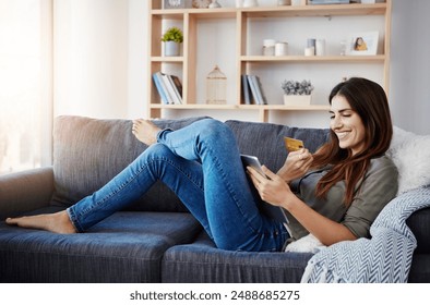 Woman, home and smile with tablet or debit card on sofa for online shopping, payment and saving plan. Female person, living room and credit verification for internet banking, budget and investment - Powered by Shutterstock