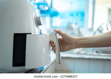 Woman At Home Using An Air Fryer. Making Healthy Food, Frying Without The Use Of Oil.