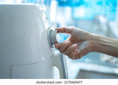 Woman At Home Using An Air Fryer. Making Healthy Food, Frying Without The Use Of Oil.