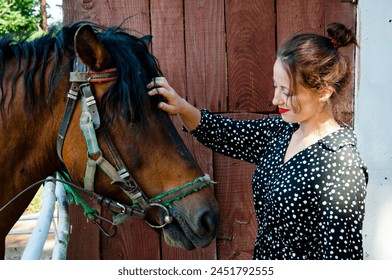 Woman with horse in stable at countryside ranch. Girl horse rider in summer outdoor. Equestrian and horseback riding. Horse stallion equine with Hispanic girl. Countryside ranch. Rancher lifestyle. - Powered by Shutterstock