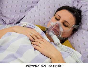 The Woman In The Hospital. CPAP Therapy Or Oxygen Mask On Her Face