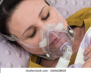 The Woman In The Hospital. CPAP Therapy Or Oxygen Mask On Her Face