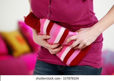 Woman With Hot Bottle And Bladder Infection