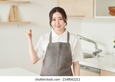 A Woman In The Housekeeping Business Doing A Guts Pose