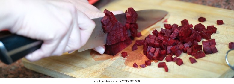 Woman Housewife Cutting Beets Into Cubes For Salad Closeup