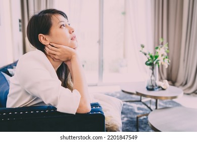 Woman Hug Self Body After Crying Looking Sad. Tired Girlfriend Cried Alone Doing Disappointed Pose Gesturing For Frustration. An Uncertain Asian Woman Sitting Knowing Relationship Is Uncomfortable.