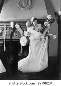 Woman In Huge Christmas Stocking With Presents