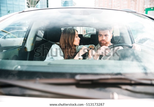 Woman hurry man in car.\
front portrait