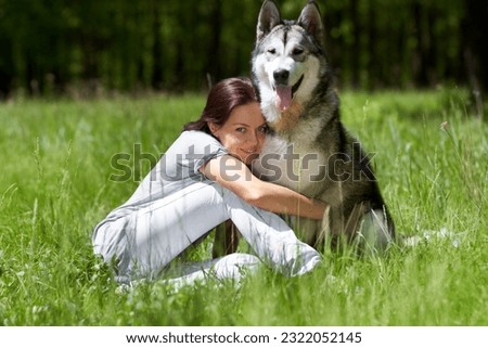 Similar – Image, Stock Photo Pretty blond woman with her two dogs