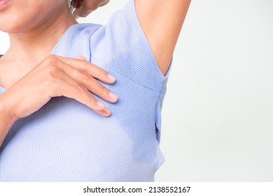 Woman Hyperhidrosis Wet Blue Shirt Underarm Hand Close Up. Problem Armpit Sweat Stains And Strong Body Odor. Hyperhidrosis Sweating.hygiene For Good Health Concept. Sweaty Under Arm.