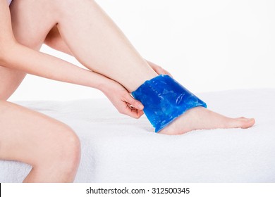 Woman With Ice Pack On Ankle