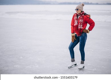 Woman Ice Skating At The Lake