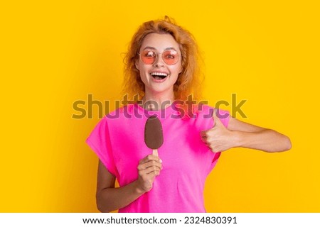 woman with icelolly ice cream in studio, thumb up. woman with icelolly ice cream
