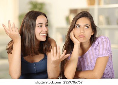 Woman ignoring the conversation of her friend at home
