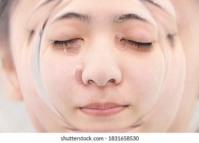 The Woman Immerses Her Face In The Water.