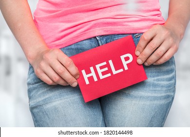 Woman With Incontinence Problem With HELP On Paper - Urinary Incontinence Concept