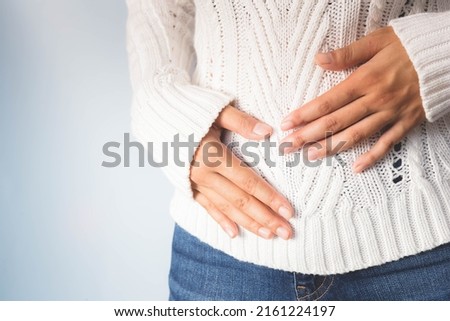 A woman with indigestion symptoms. eating disorder