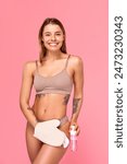 A woman is indulging in selfcare, exfoliating her skin with a mitt and applying hydrating lotion for smooth and healthy skin. Her beauty routine focuses on body care and emphasizing skin health