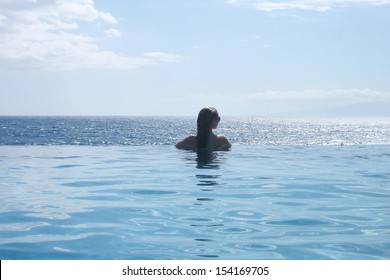 Woman In Infinity Pool