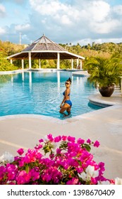 Woman At Infinity Pool During Vacation St Lucia Caribbean, Sunset By The Swimming Pool