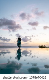 Woman At Infinity Pool During Vacation St Lucia Caribbean, Sunset By The Swimming Pool