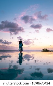 Woman At Infinity Pool During Vacation St Lucia Caribbean, Sunset By The Swimming Pool