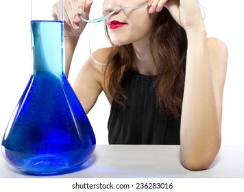 woman inhaling flavored oxygen with cannula and scented water