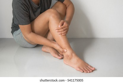 Woman Injured Leg With Calf Feeling Pain .