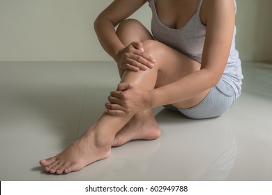 Woman Injured Leg With Calf Feeling Pain .