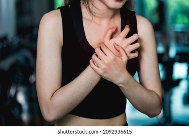 Woman Injury Pain Chest Attack Heart After Workout Training Exercise At Fitness Gym