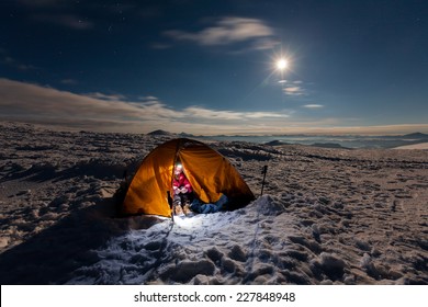 Woman Inside Tent During Winter Night