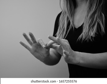Woman interpreting American Sign Language