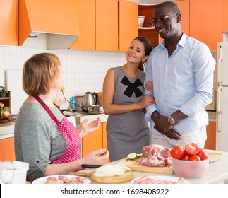 Woman Introducing Her Boyfriend Her Mother In Kitchen