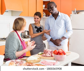 Woman Introducing Her Boyfriend Her Mother In Kitchen