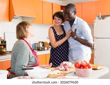 Woman Introducing Her Boyfriend Her Mother In Kitchen